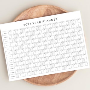 Plan your year with this 2024 Yearly Planner Printable! This digital download offers 2024 annual agenda and wall calendar template.