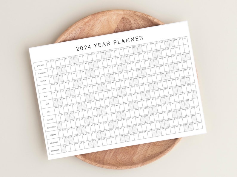 Plan your year with this 2024 Yearly Planner Printable! This digital download offers 2024 annual agenda and wall calendar template.