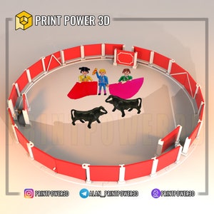 Puede incluir: Una maqueta impresa en 3D de una plaza de toros con barreras rojas y tres toreros frente a dos toros negros. Las figuras visten trajes tradicionales. Incluye el texto "PRINT POWER 3D" y perfiles de redes sociales.