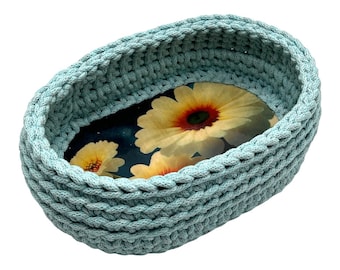 Blue oval handmade crochet basket with wooden base