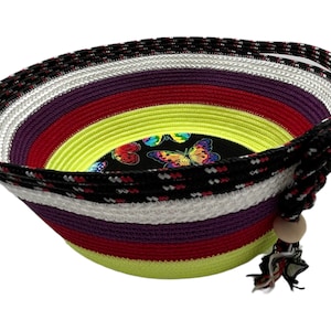 Colorful medium size handmade rope basket with one handle