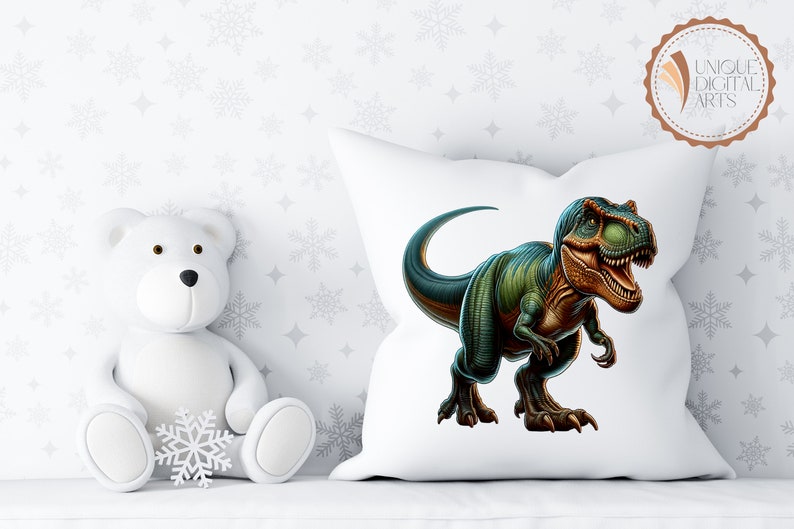 May include: White pillow with a green and brown dinosaur illustration. The dinosaur is facing right and has its mouth open. The pillow is on a white surface with a white teddy bear sitting in front of it.