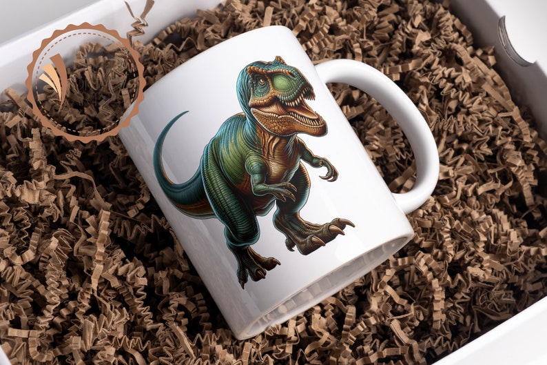 May include: White ceramic mug with a green and brown dinosaur illustration. The dinosaur is facing right and has a large mouth with sharp teeth.