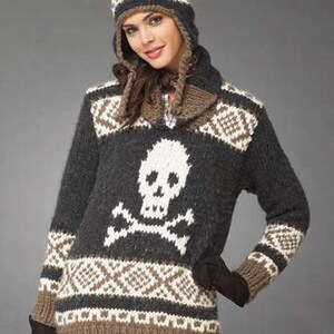 May include: A gray knitted sweater with a white skull and crossbones design. The sweater has a brown and white geometric pattern around the neck and cuffs.
