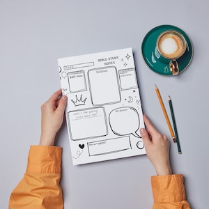 May include: A black and white printable Bible study notes page with sections for date, scripture, Bible verse, and reflection. The page is decorated with stars, hearts, and a crown.