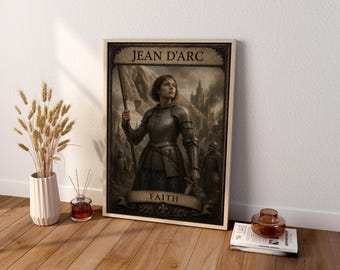 May include: A framed wall art print featuring a sepia-toned illustration of Joan of Arc in medieval armor holding a flag, with the text JEAN D'ARC at the top and FAITH on a banner at the bottom, set against a backdrop of a castle.