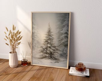 May include: A framed vertical wall art print depicting a snow-covered pine tree in a misty forest. The artwork features soft white and gray tones. The frame is light-colored wood, displayed on a wooden floor next to a vase of dried wheat.
