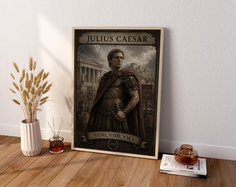 May include: A rectangular framed wall art print featuring a portrait of Julius Caesar in Roman military armor and a red cloak. The text JULIUS CAESAR appears at the top, and the text VENI, VIDI, VICI is printed on a banner at the bottom.