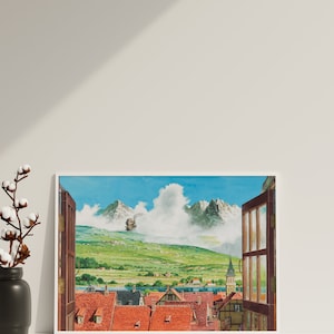 May include: A framed print of a painting depicting a small town nestled in a valley with mountains in the background. A flying machine is visible in the sky above the town. The window frame is open, revealing a view of the town.