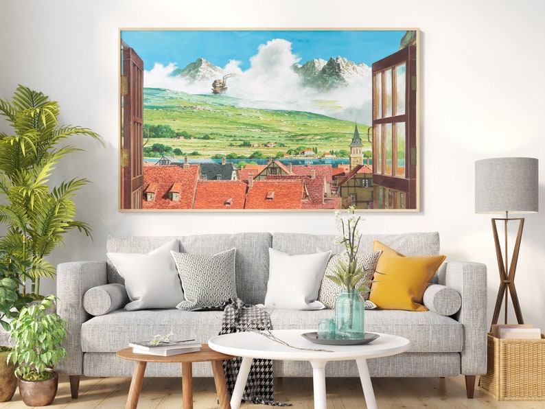 May include: A framed painting of a mountain landscape with a small town in the foreground. The painting is in a living room setting with a gray couch, a coffee table, and a floor lamp.
