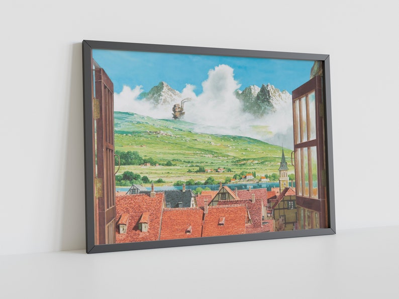 May include: A framed print of a painting depicting a view from a window. The window is open and looks out onto a small town nestled in a valley. In the distance, a large, flying machine is visible in the sky. The sky is blue and there are white clouds. The town is made up of small, colorful houses with red tile roofs. The valley is green and lush. The painting is framed in a black frame.