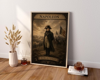 May include: A rectangular framed wall art print featuring a sepia-toned illustration of Napoleon standing on a battlefield. The text NAPOLEON is printed at the top and STRATEGY is printed at the bottom on a banner against a dark background.