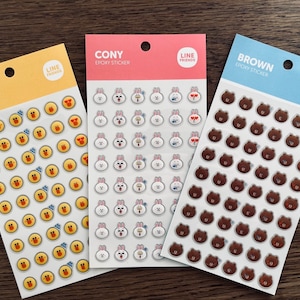 May include: Three sticker sheets featuring LINE FRIENDS characters. The "SALLY" sheet has yellow stickers with a duck design. The "CONY" sheet has white bunny stickers. The "BROWN" sheet has brown bear stickers. Each sheet has the "LINE FRIENDS" logo.