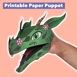 May include: A green paper dragon puppet with pink flowers and a red tongue. The puppet has a detailed design with leaves and scales. Text at the top reads "Printable Paper Puppet".