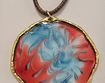 Red clear and blue swirly tie dyed inspired necklace. Adjustable Leather Cord