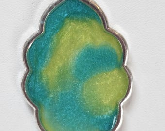 Light blue and yellow pearlescent resin pendant in a silver bezel