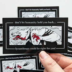 May include: Black rectangular sticker featuring a white and red werewolf illustration. The text reads "don't let humanity hold you back... lycanthropy could be right for you!" The sticker has a white border and is held by a hand.