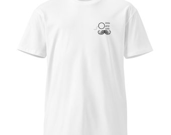 May include: White t-shirt with a black and white illustration of a monocle and mustache with the text "little grey cells".