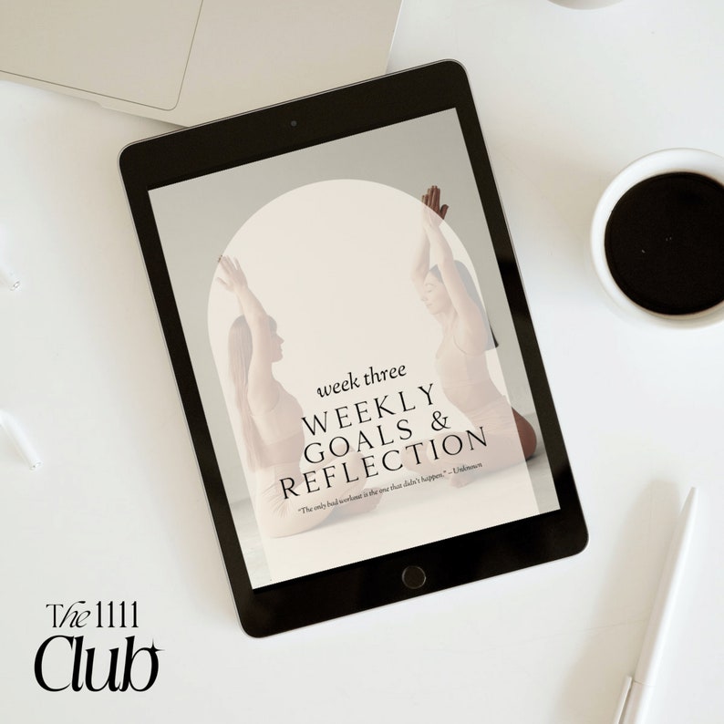 May include: A black tablet displays a wellness-themed graphic with the text "week three WEEKLY GOALS & REFLECTION." The image features two figures in yoga poses. A coffee cup, pen, and laptop are on a white surface. The logo "The 1111 Club" is in the lower left.
