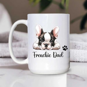 A 15oz white mug French Bulldog dad with a text says Frenchie Dad with a paw print.