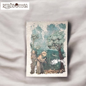 May include: A vintage-style painting of two figures in a forest setting. The figures are dressed in brown robes and are surrounded by trees and birds. The painting has a distressed, aged look with a white border.
