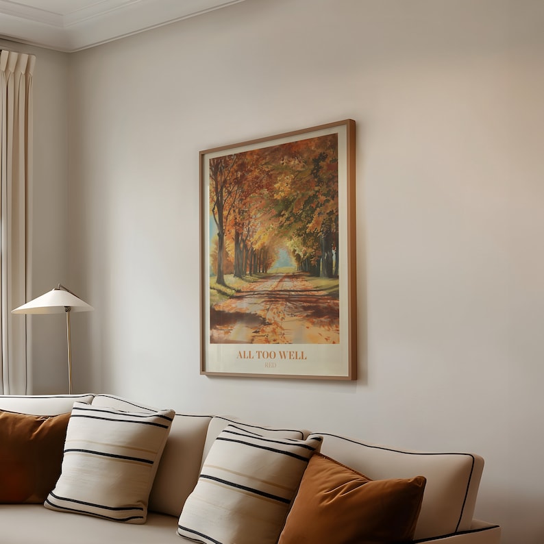 May include: A framed print of a painting depicting a path lined with trees in autumn colors. The text "ALL TOO WELL" and "1929" are printed below the image.