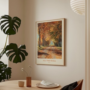 May include: A framed print of a painting depicting a path lined with trees in autumn colors. The print has the text "All Too Well" and "Red" below the image.