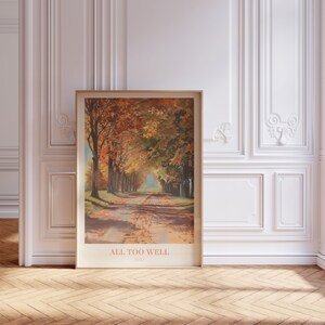 May include: A framed poster with a painting of a road lined with trees in autumn colors. The text "ALL TOO WELL" and "1991" is printed below the image.