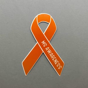 May include: Orange ribbon with the text "MS AWARENESS" printed on it.