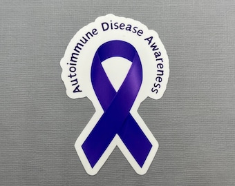 Pode incluir: Fita roxa com o texto "Autoimmune Disease Awareness" ao redor.