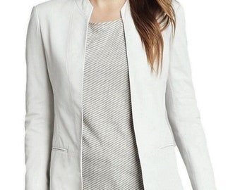 May include: A white blazer with a mandarin collar and long sleeves. The blazer has a slim fit and a single button closure.