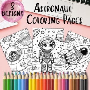 May include: Eight black and white astronaut coloring pages featuring an astronaut in a spacesuit, a rocket, and planets. The pages are on a pink surface with a set of colored pencils.