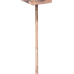 May include: A wooden birdhouse with a peaked roof and open sides, mounted on a wooden pole with a metal stake for ground placement. The birdhouse is made of stained wood, creating a rustic aesthetic.