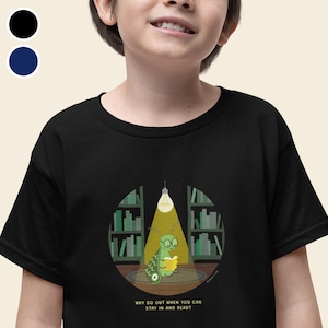 May include: Black t-shirt featuring a green bug wearing glasses and reading a book in a library setting. The text on the shirt reads "Why go out when you can stay in and read?"