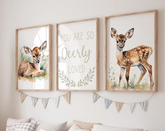 May include: Three framed prints featuring a watercolour illustration of a fawn against a green backdrop. The central print displays the text "You are so Deerly Loved" with a green wreath surrounding the words.