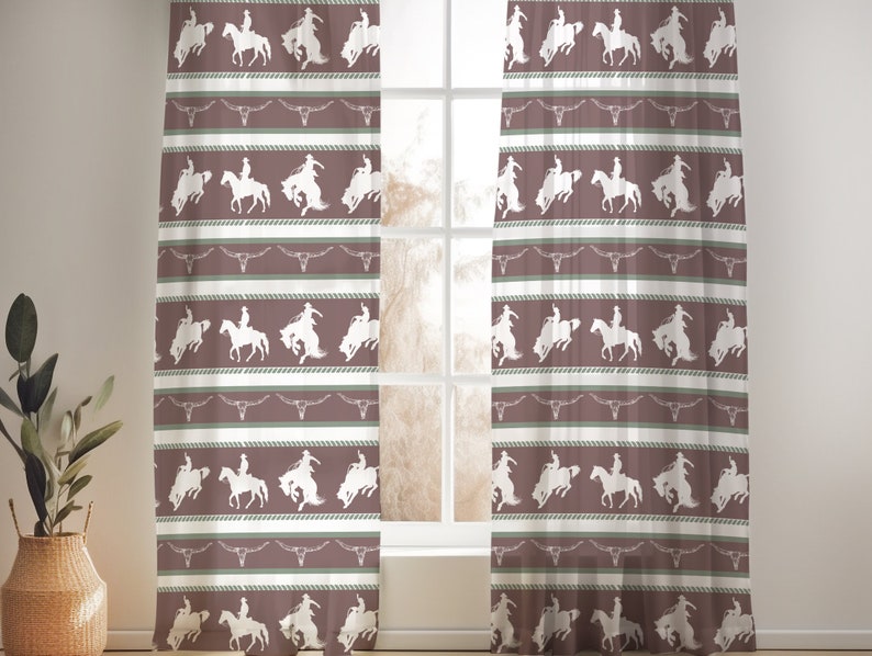 May include: A pair of sheer curtains with a repeating pattern of cowboys riding horses. The pattern is in white on a brown background with green accents.
