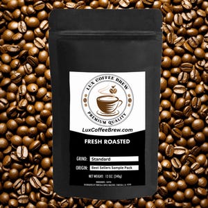 May include: A black bag of freshly roasted coffee beans with a white label that says "LUX COFFEE BREW" and "FRESH ROASTED". The label also includes the grind, origin, and net weight of the coffee. The bag is sitting on a bed of coffee beans.
