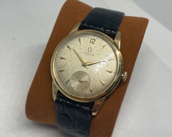 montre vintage oméga mécanique dorée bracelet cuir