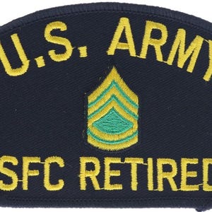 May include: A dark blue embroidered patch with a curved top edge. The text U.S. ARMY is stitched in yellow at the top, with SFC RETIRED in yellow at the bottom. Centered between the text is a Sergeant First Class rank insignia in green and yellow.