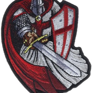 May include: An embroidered patch featuring a medieval knight in a white tunic with a red cross, wearing a helmet and chainmail. The knight holds a silver sword with a gold hilt and a white shield with a red cross, draped in a flowing red cape.