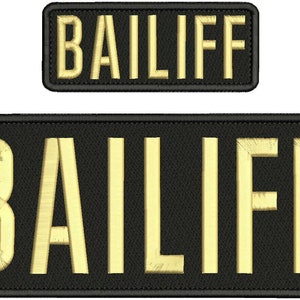 May include: Two rectangular embroidered patches with black fabric backgrounds and gold-colored thread. Each patch features the word BAILIFF in bold, capitalized, sans-serif lettering. The patches have a black stitched border around the edges.