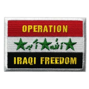 May include: A rectangular embroidered patch featuring the Iraqi flag with three horizontal stripes of red, white, and black. The word OPERATION is stitched in yellow on the red stripe, and IRAQI FREEDOM is stitched in yellow on the black stripe.