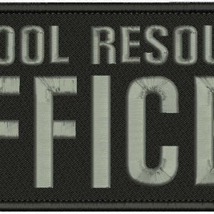 May include: A rectangular black embroidered patch with a stitched border. The text SCHOOL RESOURCE OFFICER is displayed in large, bold, light gray capital letters across the center of the patch, featuring a clean, sans-serif typeface.