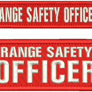May include: Two rectangular embroidered patches with a bright red background and a thick red border. The white embroidered text reads RANGE SAFETY OFFICER in a bold, sans-serif font. The top patch is narrow, while the bottom patch is wider.