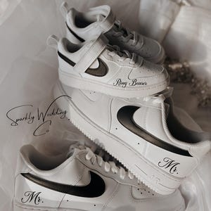 May include: White sneakers with black Nike swoosh and black text that says "Mr." and "Ring Bearer".