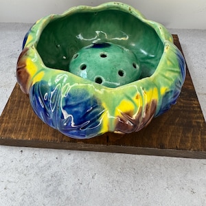 May include: A set of three ceramic mugs with a speckled, matte finish. Each mug features a different color: light blue, cream, and gray. The mugs have a simple, modern design and a comfortable handle.