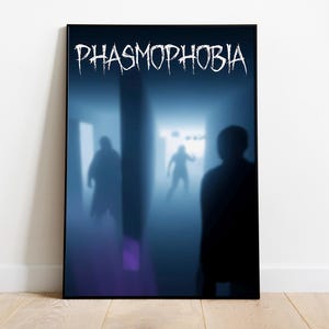 May include: Framed poster with the word "PHASMOPHOBIA" in white, stylized text. The image depicts shadowy figures in a blue-lit hallway, creating a sense of mystery and suspense. The poster is displayed on a wooden floor.