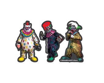 May include: Three colorful clown figures with different expressions and outfits. The clown on the left is wearing a pink, white, and yellow costume with a red nose. The clown in the middle is wearing a purple and black costume with a red hat. The clown on the right is wearing a yellow and brown costume with a white hat and a red nose. The text "WeldShop21.Com" is at the bottom of the image.