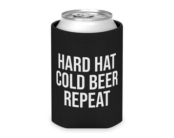May include: Black can cooler with the text "HARD HAT COLD BEER REPEAT" in white. The cooler is designed to keep beverages cold and is made of a durable material. The can cooler is a great gift for construction workers.