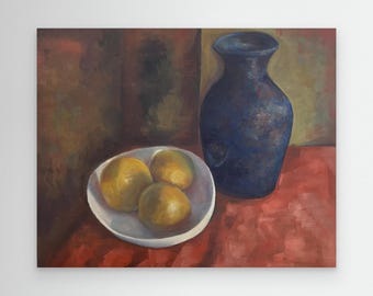 Quiet still life with three oranges resting in a simple white bowl beside a deep blue vase. Ideal for kitchens, studies, dining and living